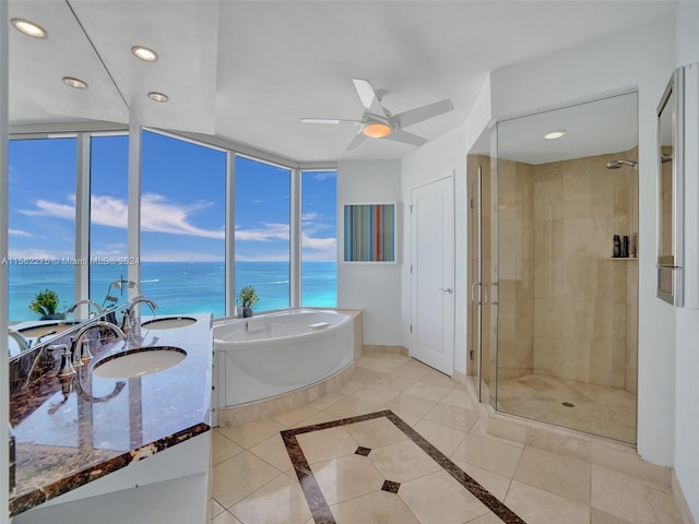 bathroom featuring ceiling fan, a water view, plus walk in shower, and tile floors