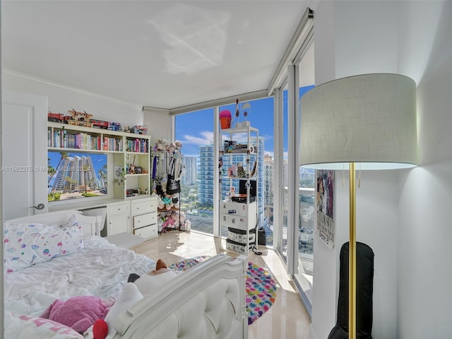 bedroom featuring crown molding, floor to ceiling windows, and access to exterior