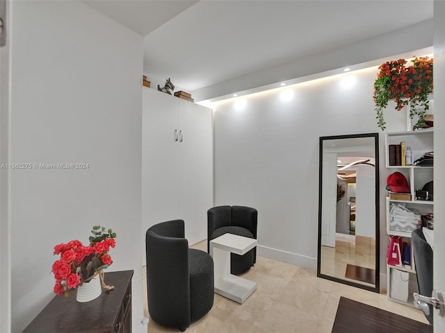 living area featuring light tile floors