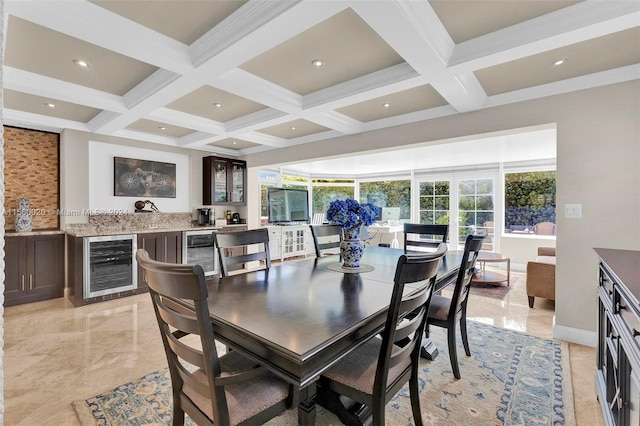 dining area featuring beverage cooler, beamed ceiling, light tile flooring, and coffered ceiling