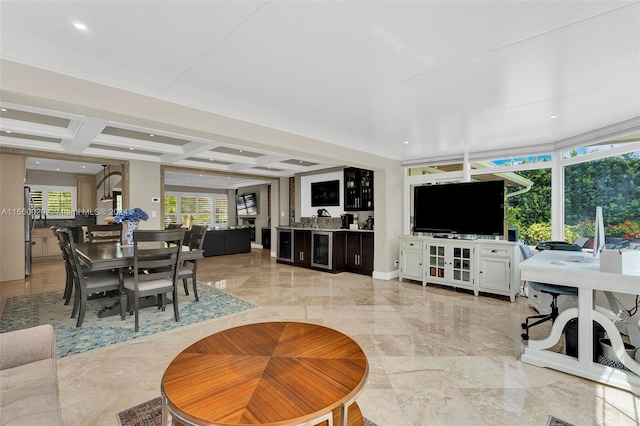 tiled living room featuring wine cooler, beamed ceiling, and coffered ceiling