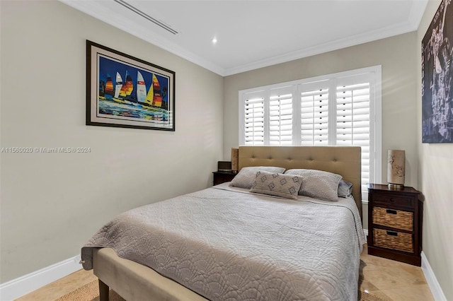 bedroom featuring ornamental molding and light tile flooring