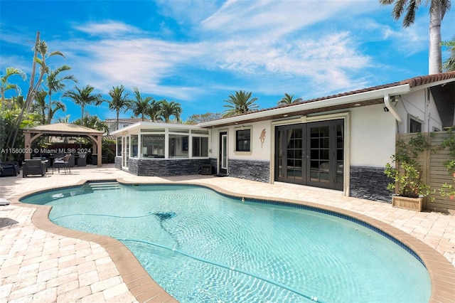 view of swimming pool featuring a gazebo and a patio