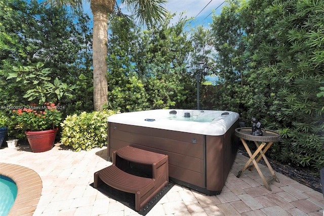 view of patio / terrace featuring a hot tub