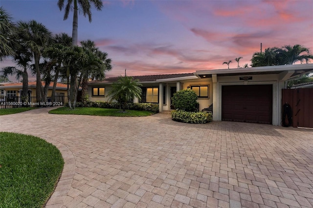 ranch-style home with a garage