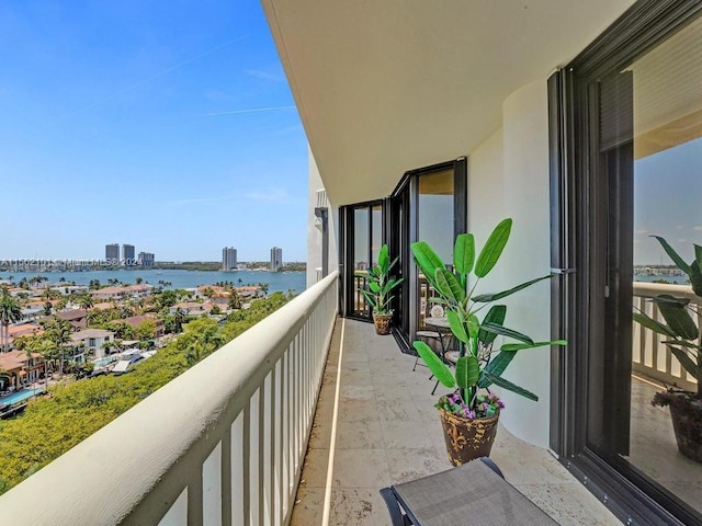 balcony featuring a water view