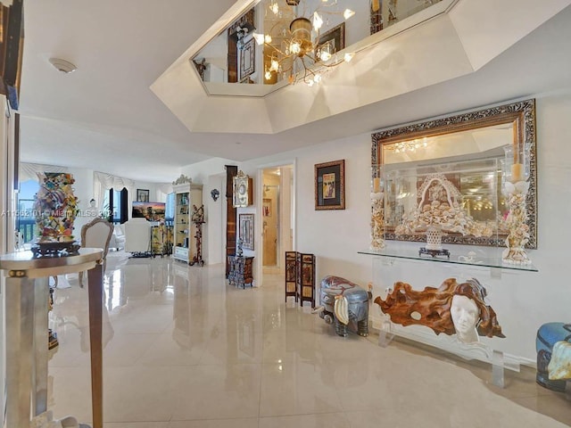 interior space with a notable chandelier and a tray ceiling