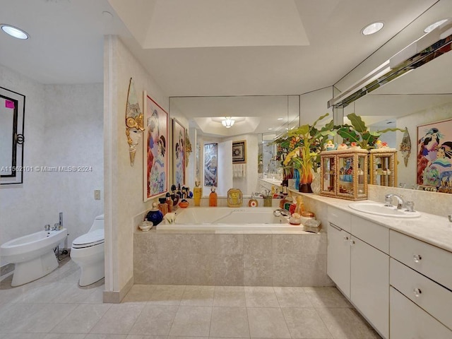 bathroom featuring a bidet, tile flooring, tiled tub, and oversized vanity