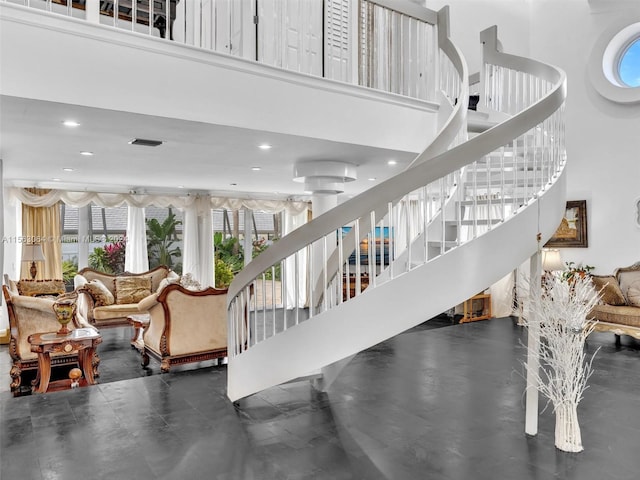 stairway with a towering ceiling