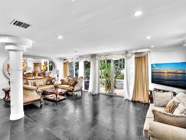 living room with ornate columns