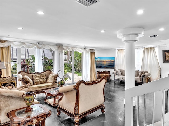 tiled living room featuring a wealth of natural light