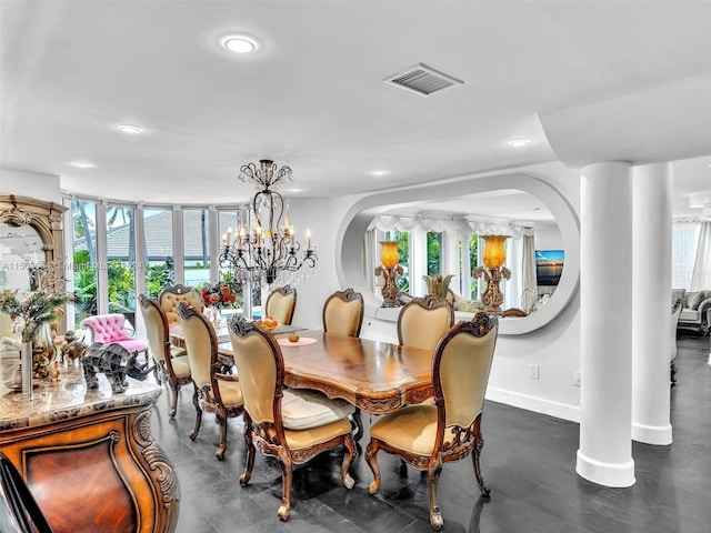 dining space featuring a healthy amount of sunlight and a chandelier