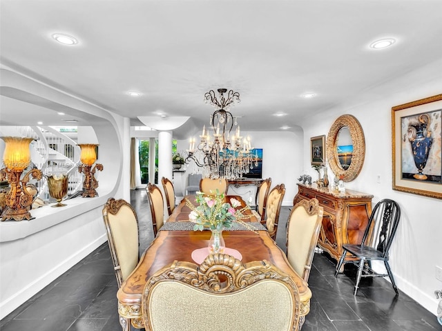 tiled dining space with a notable chandelier