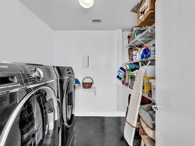 laundry room featuring washing machine and clothes dryer