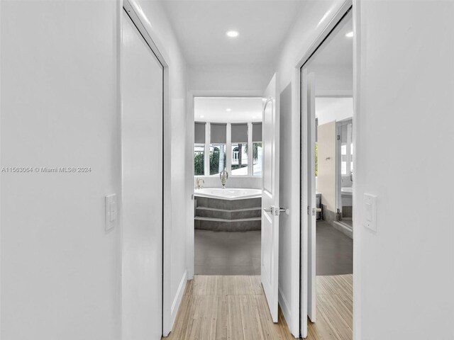 corridor featuring light hardwood / wood-style flooring