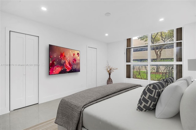 bedroom featuring light tile floors