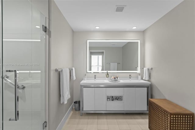 bathroom featuring vanity and an enclosed shower