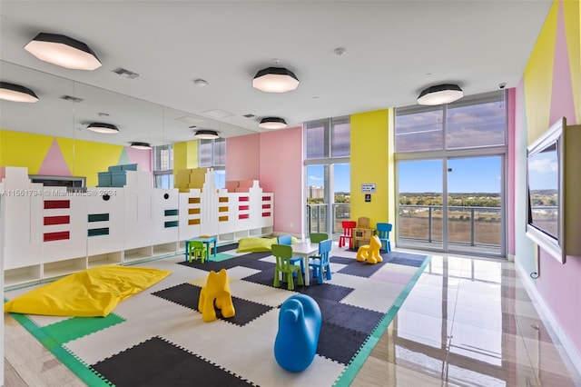 game room featuring light tile patterned floors