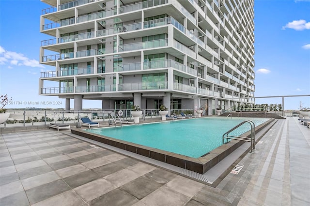 view of swimming pool with a patio area