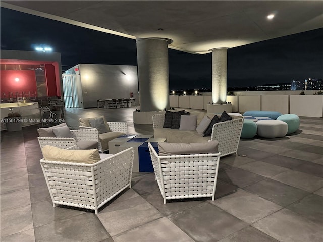 patio at twilight with outdoor lounge area