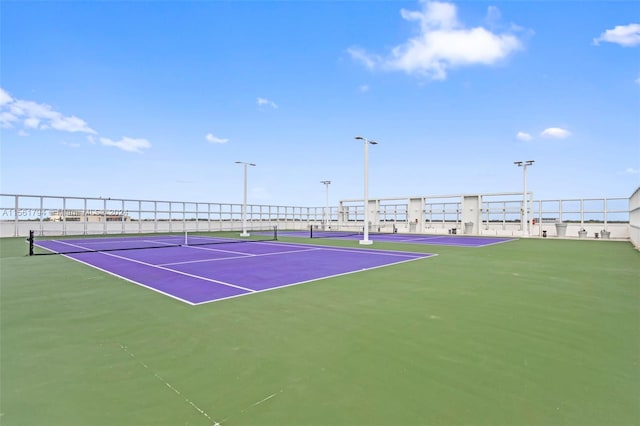 view of tennis court featuring basketball court