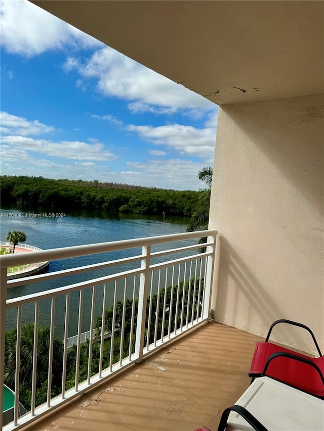 balcony featuring a water view