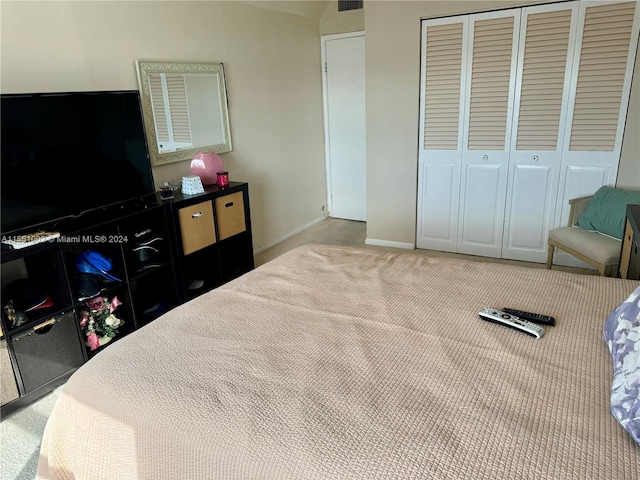 carpeted bedroom with a closet