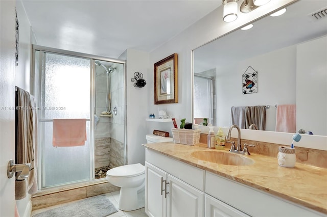 bathroom featuring an enclosed shower, vanity, tile floors, and toilet