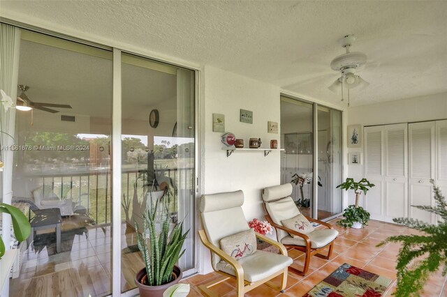 exterior space featuring ceiling fan