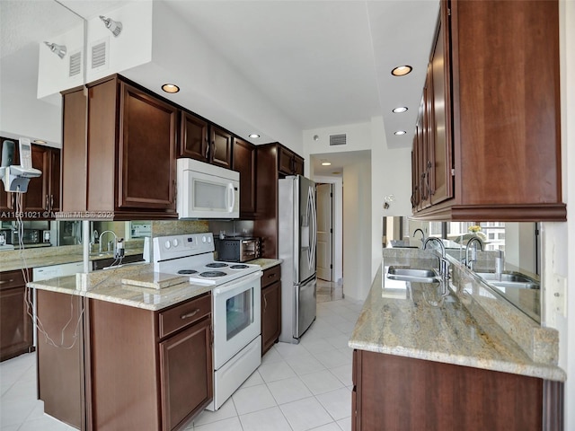 kitchen featuring light tile floors, light stone countertops, white appliances, and sink