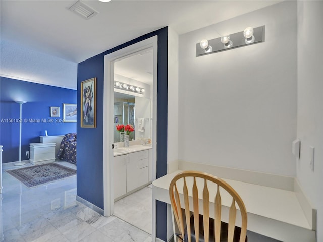 bathroom with tile floors and vanity