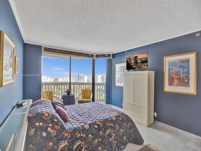 bedroom featuring multiple windows, crown molding, and a textured ceiling