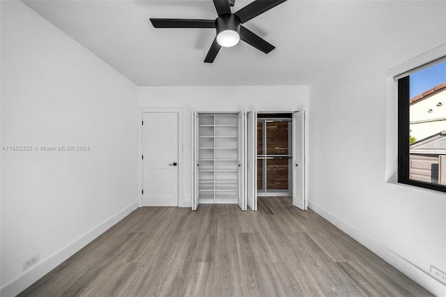 unfurnished bedroom featuring light hardwood / wood-style flooring and ceiling fan