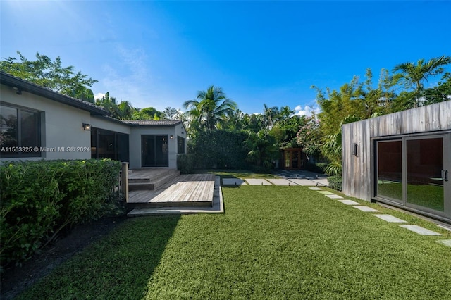 view of yard with a wooden deck