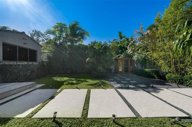 view of yard with french doors