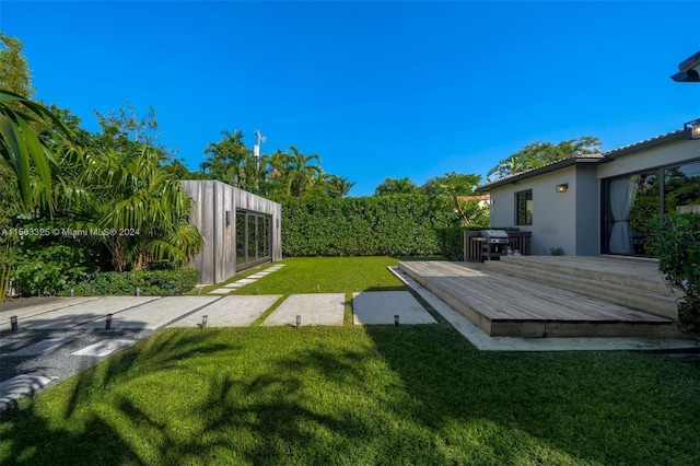 view of yard with a wooden deck