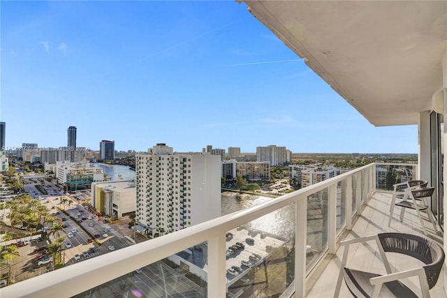 balcony featuring a water view