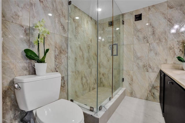 bathroom featuring tile walls, walk in shower, vanity, and toilet