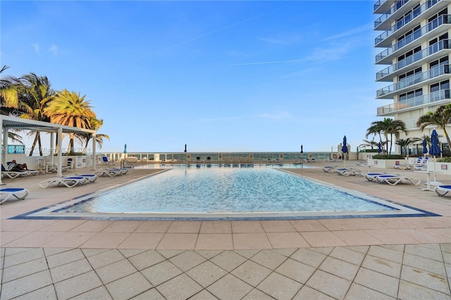 view of swimming pool featuring a patio area