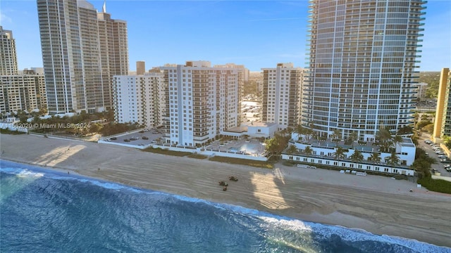 exterior space featuring a beach view and a water view