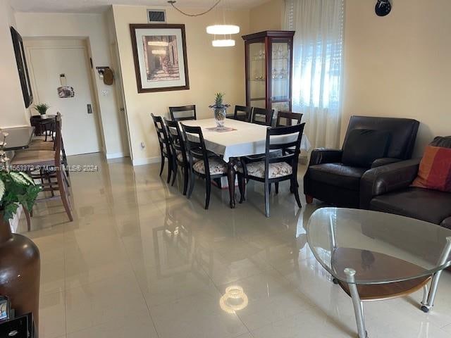 dining area with light tile flooring