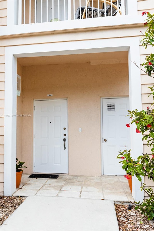 property entrance with a balcony