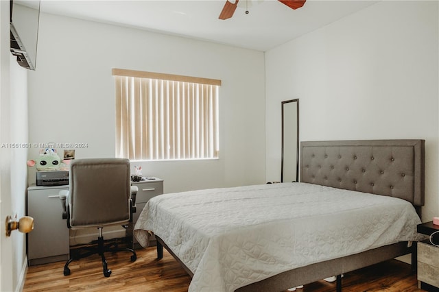 bedroom with ceiling fan and hardwood / wood-style flooring