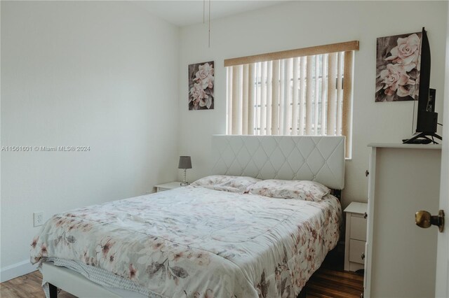 bedroom featuring dark wood-type flooring