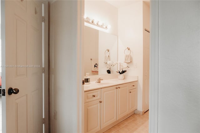 bathroom featuring tile flooring and vanity