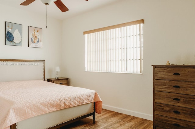 bedroom featuring ceiling fan and light hardwood / wood-style floors