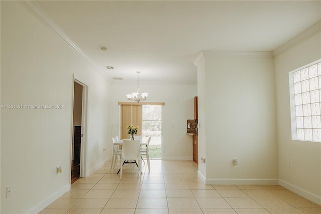 tiled empty room with a chandelier and ornamental molding