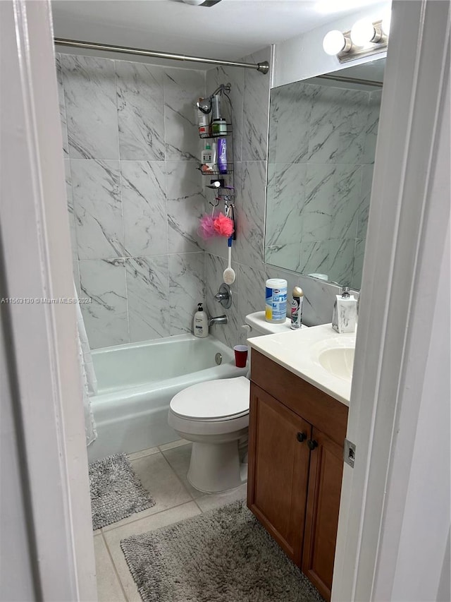 full bathroom featuring tile flooring, toilet, vanity, and shower / bath combo