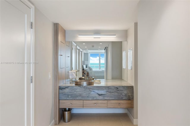 bathroom with vanity and tile floors