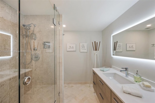 bathroom featuring walk in shower, vanity, and tile flooring